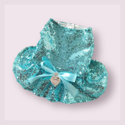 Introducing the Sniffany & CO, Sequin Glam Sniffany dress - a perfect blend of elegance and trendiness. Adorned with a satin bow, ruffled mesh inner skirt, and the iconic 'Return to Sniffany Heart' charm, this dress will make your pet the star of the show. Hand-wash with care, suitable for cats and dogs.